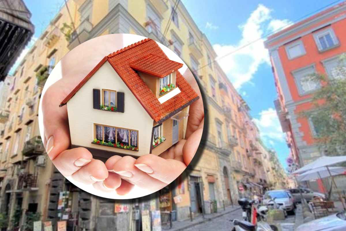 Una casetta e sullo sfondo uno scorcio di una città italiana