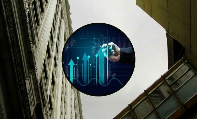 Dei palazzi con al centro una grafica di previsioni al rialzo in borsa
